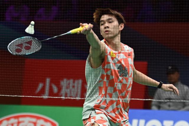 Thailand's Kunlavut Vitidsarn hits a return to India's Ayush Shetty during their men's singles semifinal match at the Badminton Asia Championship in Ningbo, eastern China's Zhejiang province on April 11, 2026. (Photo by CN-STR / AFP) / China OUT