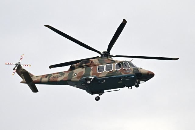 A Pakistani army helicopter flies over the Red Zone area ahead of US-Iran peace talks in Islamabad on April 11, 2026. US Vice President JD Vance arrived in Islamabad on April 11 for talks with Iran that the Pakistani premier hosting the warring sides called a "make or break" effort to permanently halt weeks of fighting in the Middle East. (Photo by Aamir QURESHI / AFP)