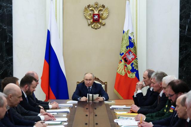 In this pool photograph distributed by the Russian state agency Sputnik, Russia's President Vladimir Putin (C) chairs a meeting on the development of artificial intelligence technologies in Moscow on April 10, 2026. (Photo by Alexander KAZAKOV / POOL / AFP) / *** Editor's note : this image is distributed by the Russian state owned agency Sputnik ***