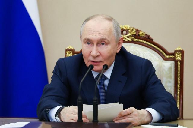 In this pool photograph distributed by the Russian state agency Sputnik, Russia's President Vladimir Putin chairs a meeting on the development of artificial intelligence technologies in Moscow on April 10, 2026. (Photo by Alexander KAZAKOV / POOL / AFP) / *** Editor's note : this image is distributed by the Russian state owned agency Sputnik ***