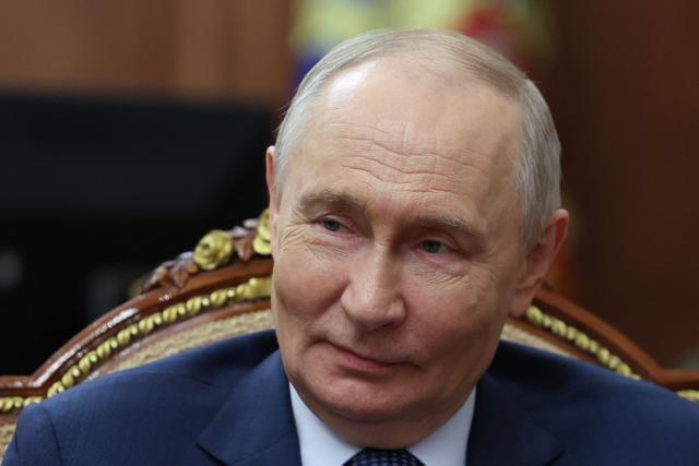 In this pool photograph distributed by the Russian state agency Sputnik, Russia's President Vladimir Putin attends a meeting with the governor of Krasnodar region in Moscow on April 10, 2026. (Photo by Alexander KAZAKOV / POOL / AFP) / *** Editor's note : this image is distributed by the Russian state owned agency Sputnik ***