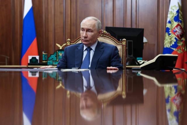 In this pool photograph distributed by the Russian state agency Sputnik, Russia's President Vladimir Putin attends a meeting with the governor of Krasnodar region in Moscow on April 10, 2026. (Photo by Alexander KAZAKOV / POOL / AFP) / *** Editor's note : this image is distributed by the Russian state owned agency Sputnik ***