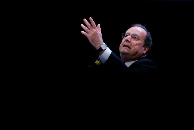 Socialistes et Apparentes' MP Francois Hollande delivers a speech during a debate session of the “Grand Dйbat des Gracques” on major national issues, at the Theatre de la Cite Internationale in Paris on April 11, 2026. (Photo by Ian LANGSDON / AFP)