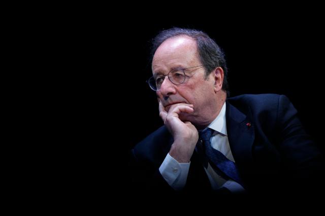Socialistes et Apparentes' MP Francois Hollande looks on during a debate session of the “Grand Dйbat des Gracques” on major national issues, at the Theatre de la Cite Internationale in Paris on April 11, 2026. (Photo by Ian LANGSDON / AFP)