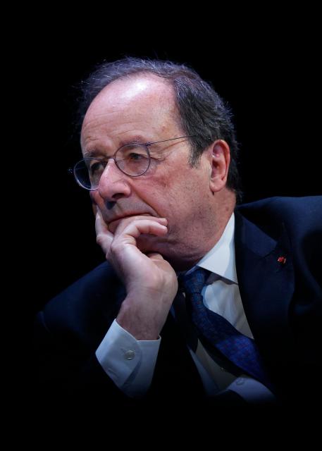 Socialistes et Apparentes' MP Francois Hollande looks on during a debate session of the “Grand Dйbat des Gracques” on major national issues, at the Theatre de la Cite Internationale in Paris on April 11, 2026. (Photo by Ian LANGSDON / AFP)