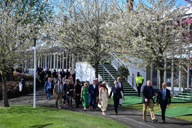 Racegoers arrive for the final day of the Grand National Festival horse race meeting at Aintree Racecourse in Liverpool, north-west England on April 11, 2026. (Photo by Paul ELLIS / AFP)