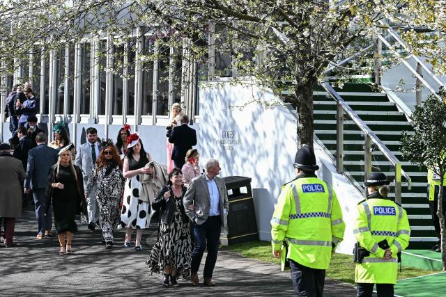 Racegoers arrive for the final day of the Grand National Festival horse race meeting at Aintree Racecourse in Liverpool, north-west England on April 11, 2026. (Photo by Paul ELLIS / AFP)