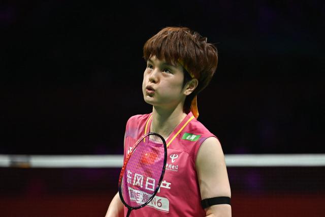 China's Wang Zhiyi reacts during the women's singles semifinal match against Japan's Akane Yamaguchi at the Badminton Asia Championship in Ningbo, eastern China's Zhejiang province on April 11, 2026. (Photo by CN-STR / AFP) / China OUT