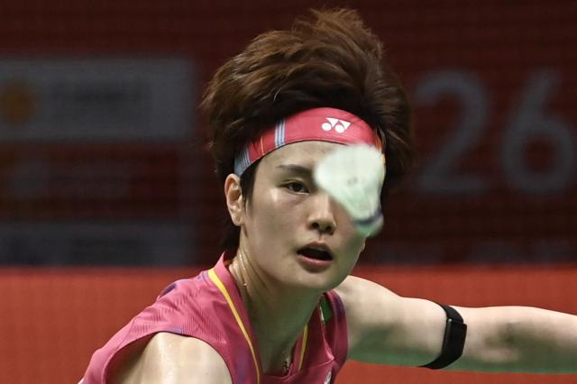 China's Wang Zhiyi eyes the shuttlecock during the women's singles semifinal match against Japan's Akane Yamaguchi at the Badminton Asia Championship in Ningbo, eastern China's Zhejiang province on April 11, 2026. (Photo by CN-STR / AFP) / China OUT