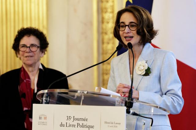 French writer Laurence Debray (R) delivers a speech flanked by French historian Annette Wieviorka (L)  during the 35th "Journee du Livre Politique", an annual event dedicated to political books, at the National Assembly of France in Paris on April 11, 2026. (Photo by STEPHANE DE SAKUTIN / AFP)