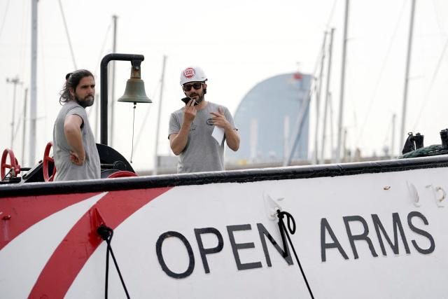 Crew members make final preparations on board the NGO ship Open Arms on the eve of the departure of a new humanitarian flotilla bound for the Gaza Strip, in Barcelona, on April 11, 2026. A new flotilla of more than 80 boats and 1,000 international pro-Palestinian activists, who attempted to reach Gaza last year, is preparing for a new mission to the devastated territory from Barcelona tomorrow. Israel's response to the Global Sumud Flotilla's first journey —intercepting the boats and arresting the activists— sparked international condemnation. (Photo by Manaure Quintero / AFP)