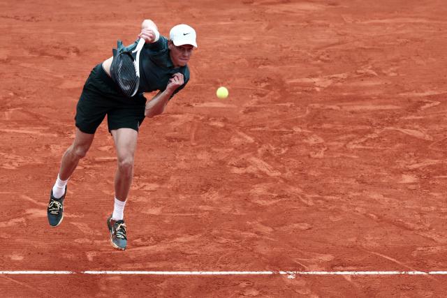 Italy's Jannik Sinner plays a backhand return to Germany's Alexander Zverev during the Monte Carlo ATP Masters Series Tournament semi-final tennis match on Court Rainier III at the Monte-Carlo Country Club in Roquebrune-Cap-Martin, south-eastern France on April 11, 2026. (Photo by Thibaud MORITZ / AFP)