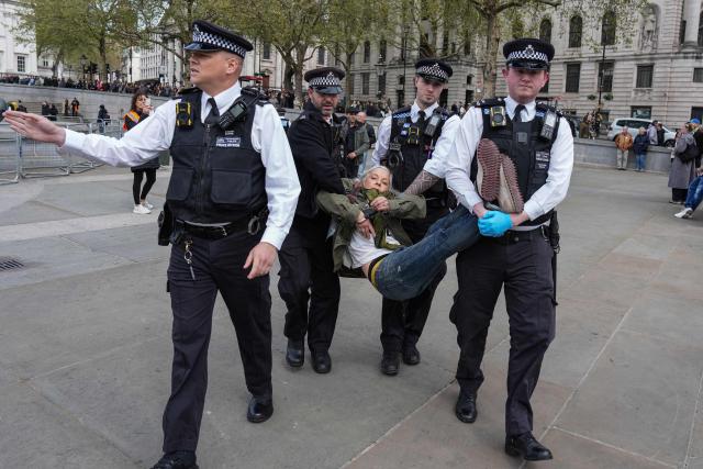 Police carry away a protester as people gather to call for the lifting of the ban on the Palestine Action group during a demonstration in Trafalgar Square in central London on April 11, 2026. Britain's Prime Minister Keir Starmer's Labour government banned Palestine Action as a terrorist organisation in 2025, making it a criminal offence to belong to or support the group. (Photo by CARLOS JASSO / AFP)