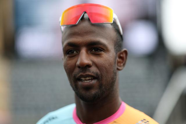 NSN Cycling Team's Eritrean rider Biniam Girmay attends the teams' presentations event on the eve of the 123rd edition of the Paris-Roubaix one-day classic cycling race, 258.3 km between Compiegne and Roubaix, in Compiegne, northern France, on April 11, 2026. (Photo by Anne-Christine POUJOULAT / AFP)