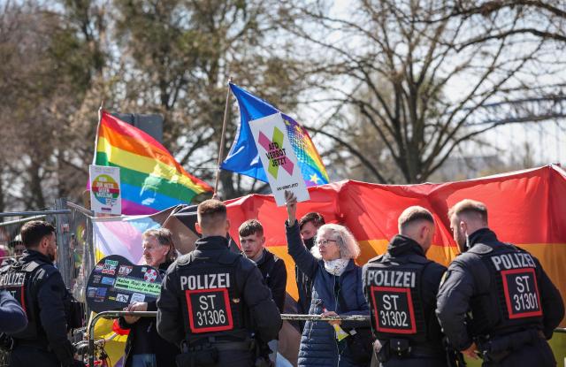 Protesters take part in a demonstration outside the Hyparschale hall in Magdeburg, eastern Germany, venue of a regional party congress of the far-right Alternative for Germany (AfD), on April 11, 2026. The AfD in the eastern federal state of Saxony-Anhalt holds a two-day party convention to prepare regional elections scheduled for September 6, 2026. (Photo by RONNY HARTMANN / AFP)