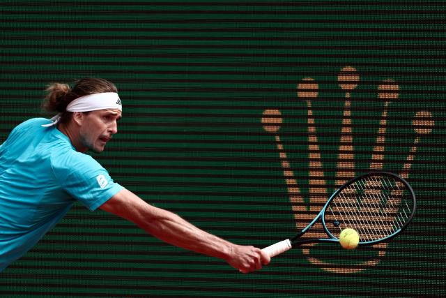 Germany's Alexander Zverev plays a backhand return to Italy's Jannik Sinner during the Monte Carlo ATP Masters Series Tournament semi-final tennis match on Court Rainier III at the Monte-Carlo Country Club in Roquebrune-Cap-Martin, south-eastern France on April 11, 2026. (Photo by Thibaud MORITZ / AFP)