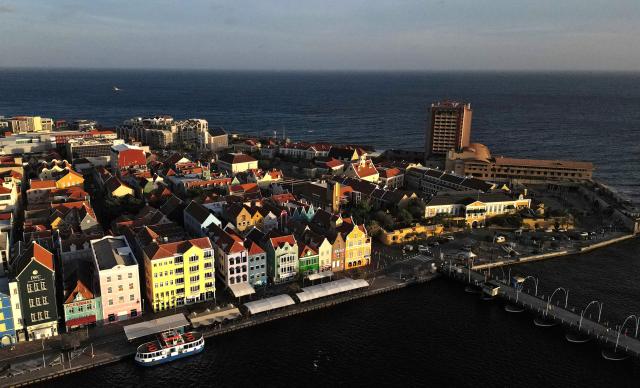 Aerial view showing the historical center in Willemstad, in the Dutch Caribbean, on April 10, 2026. (Photo by Raul ARBOLEDA / AFP)
