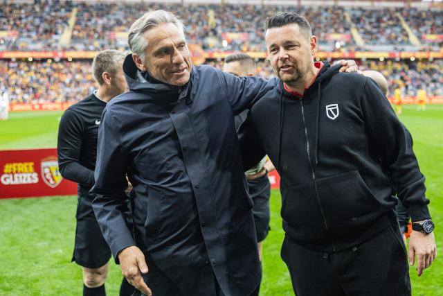 Lens' French head coach Pierre Sage (R) and Rouen's French head coach Regis Brouard react ahead of the friendly football match between RC Lens and FC Rouen in solidarity with jailed French sports journalist Christophe Gleizes at the Stade Bollaert-Delelis in Lens, northern France, on April 11, 2026. Gleizes was arrested in May 2024 and sentenced to seven years in prison in Algeria while travelling to northeastern Algeria's Kabylia region to write about the country's most decorated football club, Jeunesse Sportive de Kabylie. (Photo by Sameer Al-DOUMY / AFP)