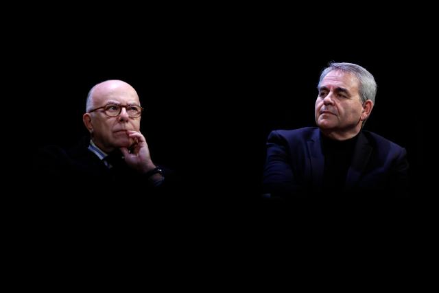 Former French Prime Minister Bernard Cazeneuve (L) and Hauts-de-France Regional Council President Xavier Bertrand attend a debate session of the “Grand Dйbat des Gracques” on major national issues, at the Theatre de la Cite Internationale in Paris on April 11, 2026. (Photo by Ian LANGSDON / AFP)