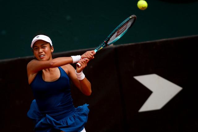 France's Tiantsoa Sarah "Titi" Rakotomanga Rajaonah returns the ball against Serbia's Teodora Kostovic during their Billie Jean King Cup Group I Europe/Africa play-offs women's singles tennis match in Oeiras, on the outskirts of Lisbon, on April 11, 2026. (Photo by FILIPE AMORIM / AFP)