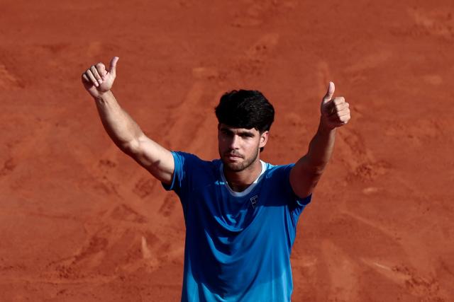 Spain's Carlos Alcaraz gives thumbs up as he celebrates after winning against Monaco's Valentin Vacherot following the Monte Carlo ATP Masters Series Tournament semi-final tennis match on Court Rainier III at the Monte-Carlo Country Club in Roquebrune-Cap-Martin, south-eastern France on April 11, 2026. (Photo by Thibaud MORITZ / AFP)