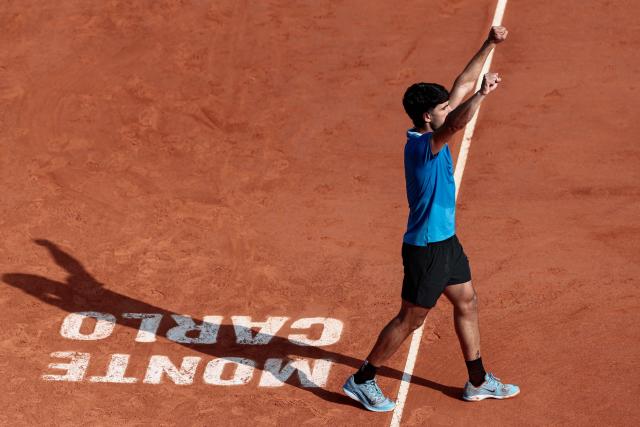 Spain's Carlos Alcaraz celebrates after winning against Monaco's Valentin Vacherot following the Monte Carlo ATP Masters Series Tournament semi-final tennis match on Court Rainier III at the Monte-Carlo Country Club in Roquebrune-Cap-Martin, south-eastern France on April 11, 2026. (Photo by Thibaud MORITZ / AFP)
