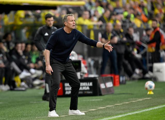 Bayer Leverkusen's Danish head coach Kasper Hjulmand reacts during the German first division Bundesliga football match between Borussia Dortmund and Bayer Leverkusen in Dortmund, western Germany, on April 11, 2026. (Photo by INA FASSBENDER / AFP) / DFL REGULATIONS PROHIBIT ANY USE OF PHOTOGRAPHS AS IMAGE SEQUENCES AND/OR QUASI-VIDEO