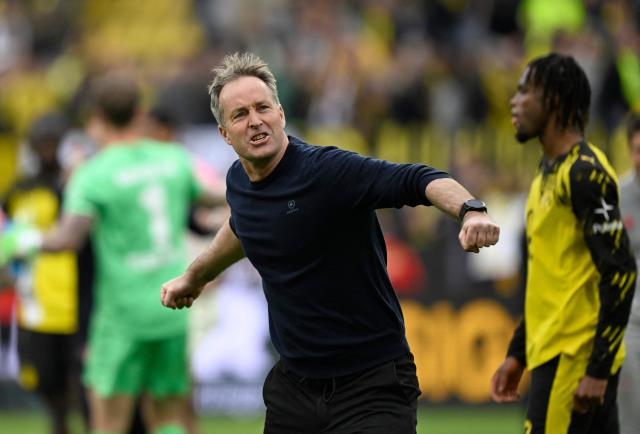 Bayer Leverkusen's Danish head coach Kasper Hjulmand reacts at the end of the German first division Bundesliga football match between Borussia Dortmund and Bayer Leverkusen in Dortmund, western Germany, on April 11, 2026. (Photo by INA FASSBENDER / AFP) / DFL REGULATIONS PROHIBIT ANY USE OF PHOTOGRAPHS AS IMAGE SEQUENCES AND/OR QUASI-VIDEO