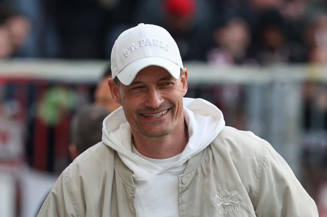 St Pauli's German head coach Alexander Blessin arrives prior to the German first division Bundesliga football match between FC St Pauli and FC Bayern Munich in Hamburg, northern Germany, on April 11, 2026. (Photo by Ibo OT / AFP) / DFL REGULATIONS PROHIBIT ANY USE OF PHOTOGRAPHS AS IMAGE SEQUENCES AND/OR QUASI-VIDEO