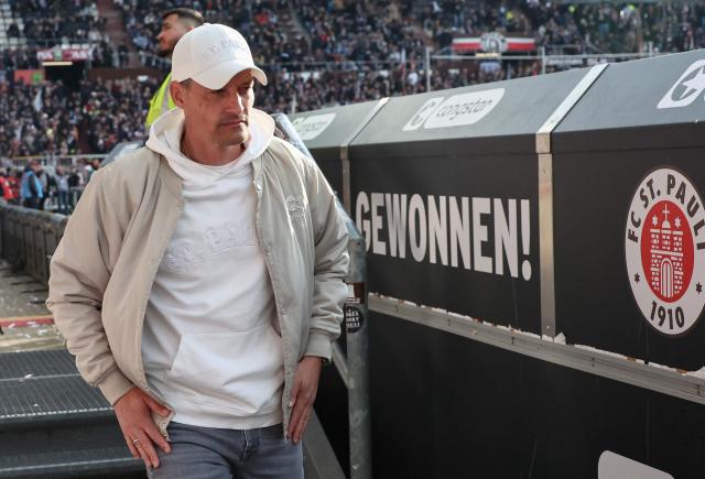 St Pauli's German head coach Alexander Blessin arrives prior to the German first division Bundesliga football match between FC St Pauli and FC Bayern Munich in Hamburg, northern Germany, on April 11, 2026. (Photo by Ibo OT / AFP) / DFL REGULATIONS PROHIBIT ANY USE OF PHOTOGRAPHS AS IMAGE SEQUENCES AND/OR QUASI-VIDEO