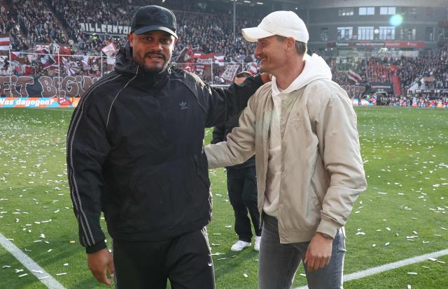 Bayern Munich's Belgian head coach Vincent Kompany (L) and St Pauli's German head coach Alexander Blessin greet each other prior to the German first division Bundesliga football match between FC St Pauli and FC Bayern Munich in Hamburg, northern Germany, on April 11, 2026. (Photo by Ibo OT / AFP) / DFL REGULATIONS PROHIBIT ANY USE OF PHOTOGRAPHS AS IMAGE SEQUENCES AND/OR QUASI-VIDEO