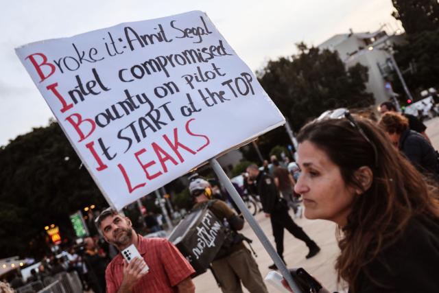 Israeli left-wing activists demonstrate in HaBima Square against the ongoing war with Iran and against the Israeli government in Tel Aviv on April 11, 2026. Since the ceasefire between Israel, the United States, and Iran came into effect, a relative calm has prevailed, with no bombings reported in Iran or the Gulf, after five weeks of conflict that left thousands dead, primarily in Iran and Lebanon. (Photo by Jack GUEZ / AFP)