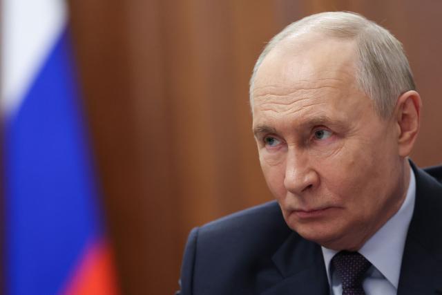 In this pool photograph distributed by the Russian state agency Sputnik, Russia's President Vladimir Putin attends a meeting with the Director General of Roscosmos Russian State Space Corporation in Moscow on April 11, 2026. (Photo by Alexander KAZAKOV / POOL / AFP) / Editor's note: this image is distributed by the Russian state owned agency Sputnik