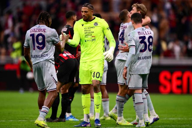 Udinese's Nigerian goalkeeper #40 Maduka Okoye (C) and Udinese's Dutch defender #19 Kingsley Ehizibue (L) celebrate their team's victory at the end of the Italian Serie A football match between AC Milan and Udinese at the San Siro Stadium in Milan, northern Italy, on April 11, 2026. Udinese’s Nigerian goalkeeper #40 Maduka Okoye (C) and Udinese’s Dutch defender #19 Kingsley Ehizibue celebrate the victory at the end of the Italian Serie A football match between AC Milan and Udinese at the San Siro stadium in Milan, northern Italy, on April 11, 2026. (Photo by MARCO BERTORELLO / AFP)