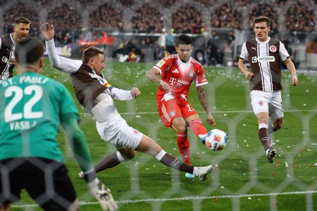 Bayern Munich's Colombian forward #14 Luis Diaz attempts to score during the German first division Bundesliga football match between FC St Pauli and FC Bayern Munich in Hamburg, northern Germany, on April 11, 2026. (Photo by Ibo OT / AFP) / DFL REGULATIONS PROHIBIT ANY USE OF PHOTOGRAPHS AS IMAGE SEQUENCES AND/OR QUASI-VIDEO