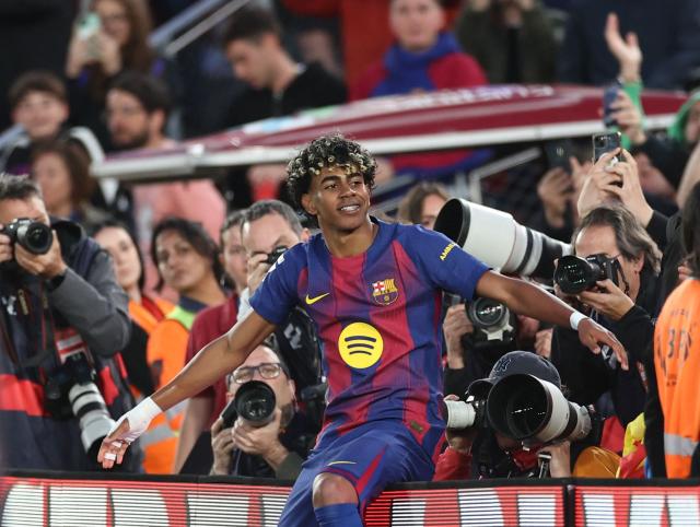 Barcelona's Spanish forward #10 Lamine Yamal celebrates scoring his team's third goal during the Spanish league football match between FC Barcelona and RCD Espanyol at the Camp Nou stadium in Barcelona on April 11 , 2026. (Photo by Josep LAGO / AFP)
