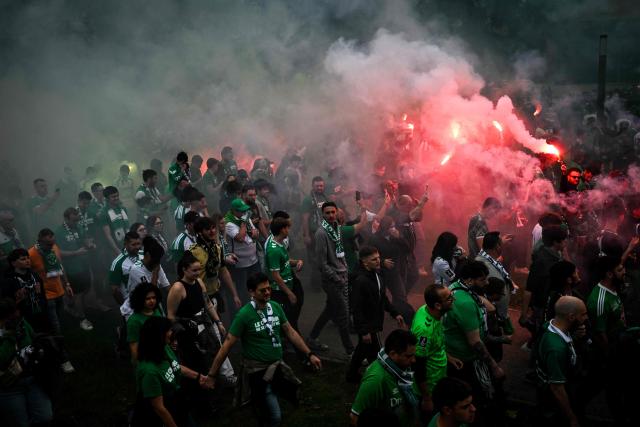 Supporters of French football club AS Saint-Etienne (ASSE) demonstrate against the potential disbandment of the Magic Fans and Green Angels, two of the club's main supporter groups, in Saint-Etienne, south-eastern France on April 11, 2026. The two ultra groups are due to appear before a national advisory commission on sports violence prevention on April 13, following a new dissolution procedure launched by the Interior Ministry. The supporter groups have been accused of having instigated incidents with law enforcement in Dunkirk on December 6, 2025 and again on March 14, 2026 in Grenoble. (Photo by OLIVIER CHASSIGNOLE / AFP)