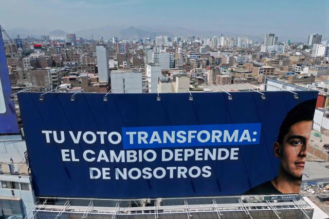 Aerial view of a billboard reading "Your vote transforms: Change depends on us" in Lima on April 11, 2026, on the eve of presidential elections. Peru, which has had eight presidents in ten years, will hold general election on April 12, 2026, in which voters will have to choose among 35 candidates. (Photo by Luis ROBAYO / AFP)