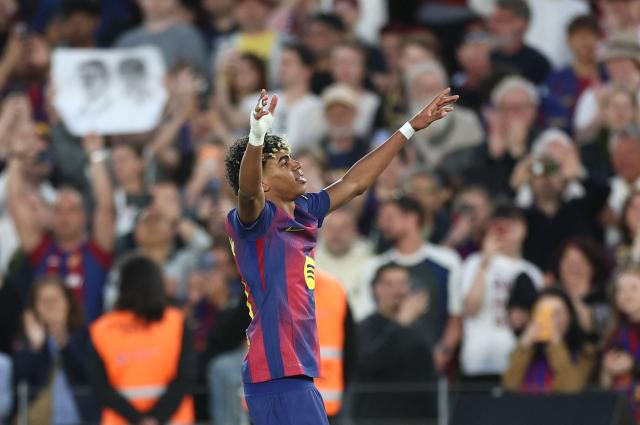 Barcelona's Spanish forward #10 Lamine Yamal celebrates scoring his team's third goal during the Spanish league football match between FC Barcelona and RCD Espanyol at the Camp Nou stadium in Barcelona on April 11 , 2026. (Photo by Josep LAGO / AFP)