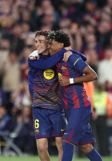 Barcelona's Spanish forward #10 Lamine Yamal and Barcelona's Spanish midfielder #16 Fermin Lopez celebrate after Barcelona's English forward #14 Marcus Rashford's goal during the Spanish league football match between FC Barcelona and RCD Espanyol at the Camp Nou stadium in Barcelona on April 11 , 2026. (Photo by Josep LAGO / AFP)