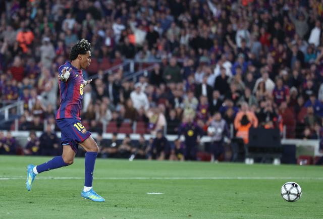 Barcelona's Spanish forward #10 Lamine Yamal celebrates while scoring his team's third goal during the Spanish league football match between FC Barcelona and RCD Espanyol at the Camp Nou stadium in Barcelona on April 11 , 2026. (Photo by Josep LAGO / AFP)