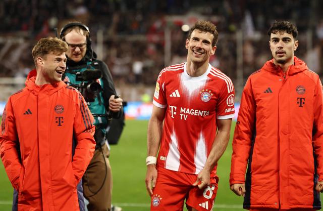 (L-R) Bayern Munich's German midfielder #06 Joshua Kimmich, Bayern Munich's German midfielder #08 Leon Goretzka and Bayern Munich's German midfielder #45 Aleksandar Pavlovic react after the German first division Bundesliga football match between FC St Pauli and FC Bayern Munich in Hamburg, northern Germany, on April 11, 2026. (Photo by Ibo OT / AFP) / DFL REGULATIONS PROHIBIT ANY USE OF PHOTOGRAPHS AS IMAGE SEQUENCES AND/OR QUASI-VIDEO
