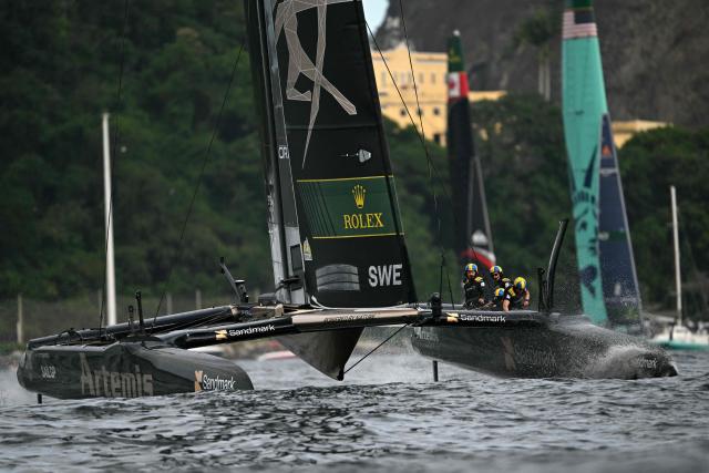 Sweden's team sail in front of the US' team during the Rio 2026 SailGP race day 1, in Guanabara Bay in Rio de Janeiro, Brazil on April 11, 2026. (Photo by Mauro PIMENTEL / AFP)