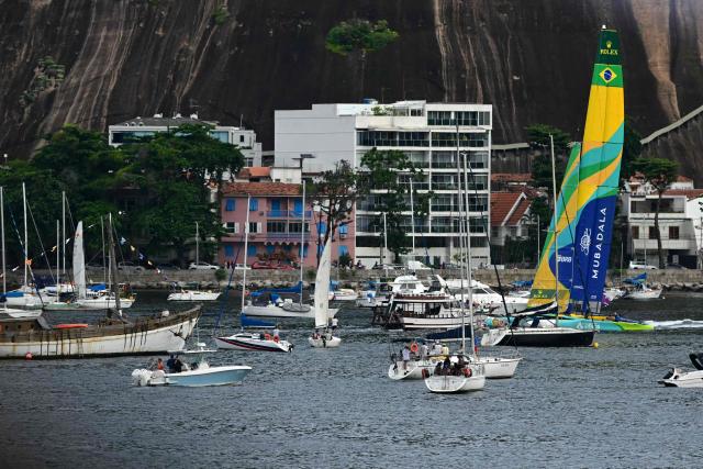 Brazil’s team arrives for the third race after missing the earlier events due to technical problems during the Rio 2026 SailGP race day 1, in Guanabara Bay in Rio de Janeiro, Brazil on April 11, 2026. (Photo by Pablo PORCIUNCULA / AFP)