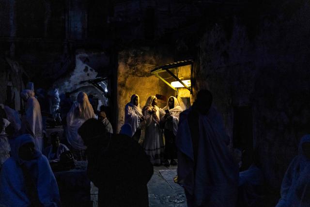 TOPSHOT - Ethiopian Orthodox christian followers gather ahead of their annual Holy Fire ceremony at Jerusalem’s Church of the Holy Sepulchre on April 11, 2026. The ceremony celebrated in the same way for 11 centuries, is marked by the appearance of "sacred fire" in the two cavities on either side of the Holy Sepulchre. (Photo by JOHN WESSELS / AFP)