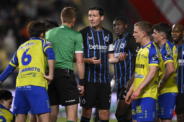 Club Brugge's Belgian midfielder #20 Hans Vanaken (C) reacts during the Belgian "Pro League" champions' play-off (day 2 out of 10) football match between Sint-Truiden VV and Club Brugge at the Stayen Stadium in Sint-Truiden on April 11, 2026. (Photo by Johan Eyckens / Belga / AFP) / Belgium OUT