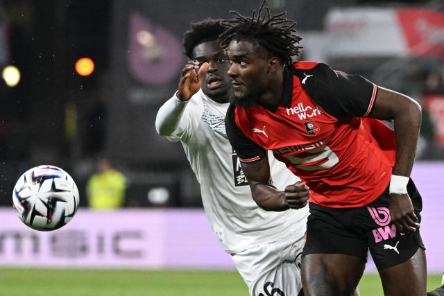 Angers' French forward #36 Lanroy Machine (L) fights for the ball with Rennes' French defender #3 Lilian Brassier during the French L1 football match between Stade Rennais FC and SCO Angers at the Roazhon Park stadium in Rennes, western France, on April 11, 2026. (Photo by Sebastien Salom-Gomis / AFP)