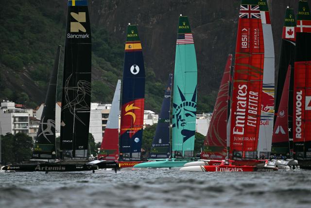 (L to R) Sweden, Spain, US, Great Britain, Canada, and Denmark compete during the Rio 2026 SailGP race day 1, in Guanabara Bay in Rio de Janeiro, Brazil on April 11, 2026. (Photo by Mauro PIMENTEL / AFP)