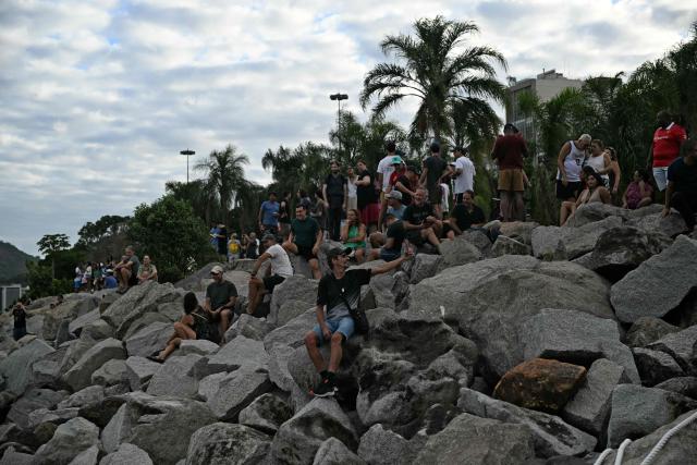 Sailing enthusiasts attend the Rio 2026 SailGP race day 1, in Guanabara Bay in Rio de Janeiro, Brazil on April 11, 2026. (Photo by Mauro PIMENTEL / AFP)