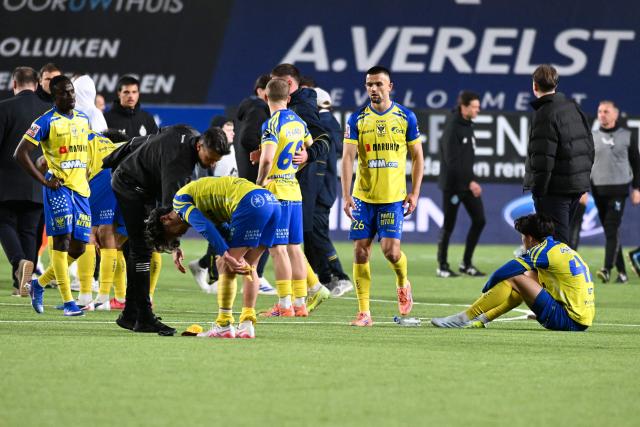 STVV's players react at the end of the Belgian "Pro League" champions' play-off (day 2 out of 10) football match between Sint-Truiden VV and Club Brugge at the Stayen Stadium in Sint-Truiden on April 11, 2026. (Photo by JILL DELSAUX / Belga / AFP) / Belgium OUT